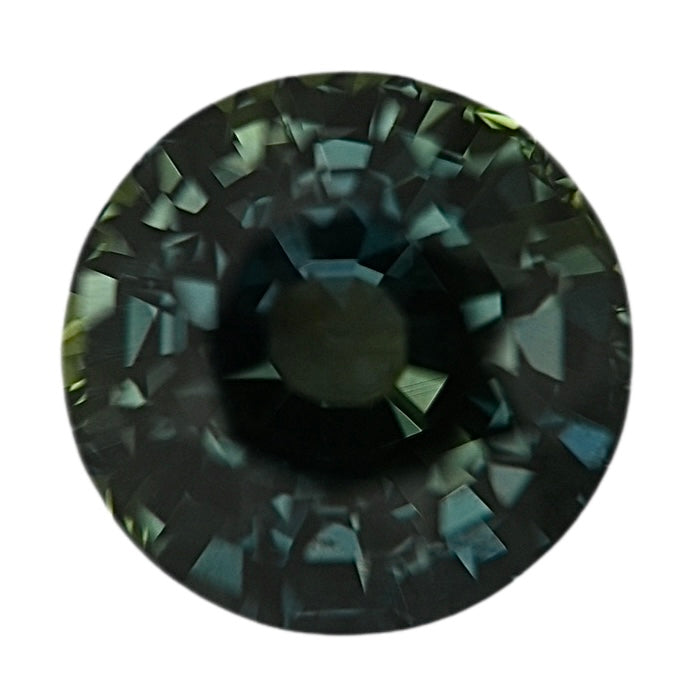 Round dark green sapphire gemstone with faceted cut