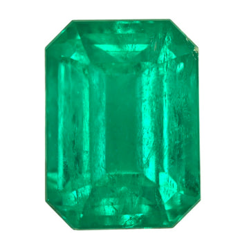 Large octagonal green emerald gemstone close-up with visible facets