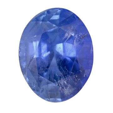 Oval blue sapphire gemstone with faceted surface