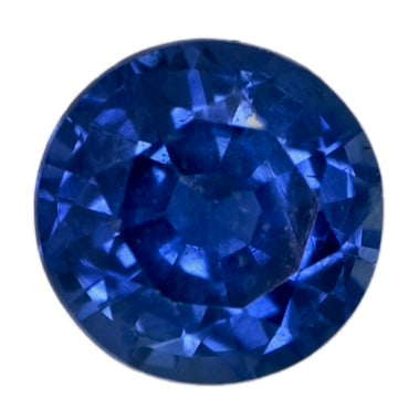 Round blue sapphire gemstone with faceted cut, reflective facets