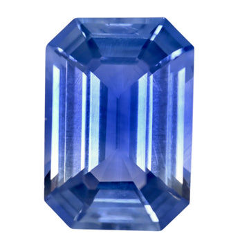 Octagon-cut bi-color sapphire gemstone, deep blue with lighter blue tones