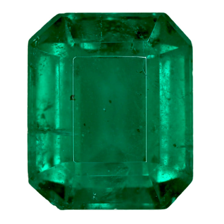 Faceted green emerald gemstone close-up, octagonal step-cut