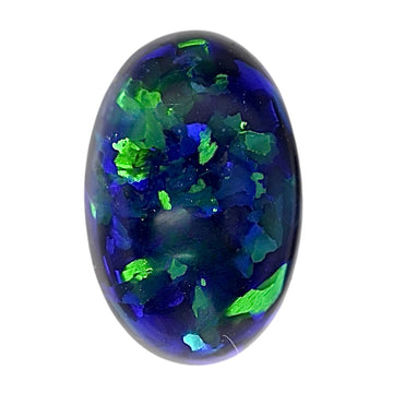 Oval black opal cabochon with vivid blue and green flashes