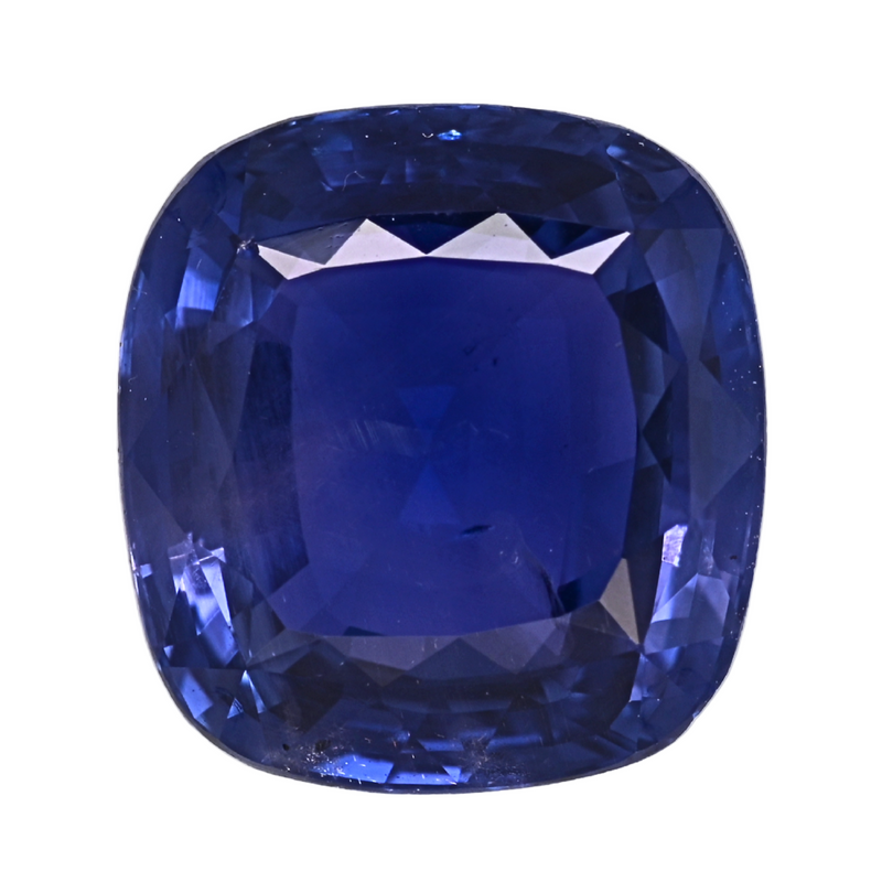Deep blue cushion-cut sapphire gemstone with mirror-like facets