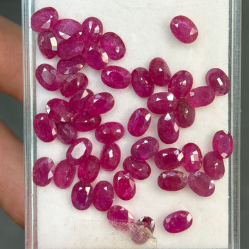 Ruby gemstone lot, oval faceted red-pink stones