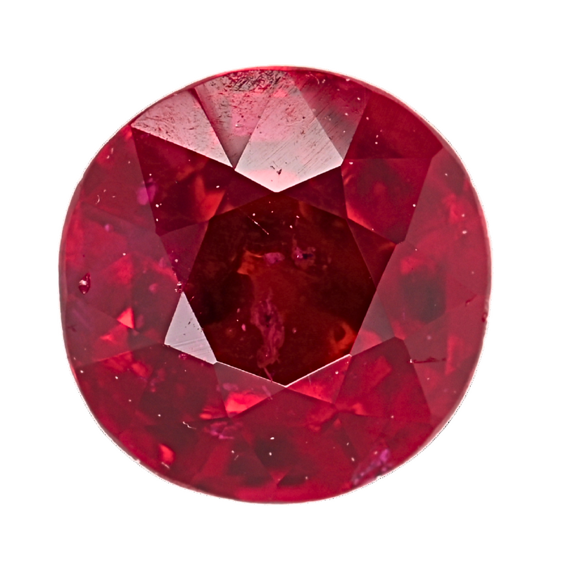 Close-up faceted round ruby gemstone in vivid red, showing crown and facets