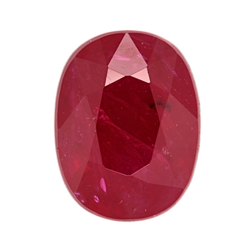 Oval ruby gemstone close-up, faceted top and pavilion facets visible