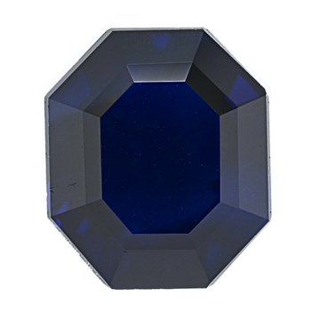 Close-up of dark blue faceted sapphire gemstone with octagonal facets