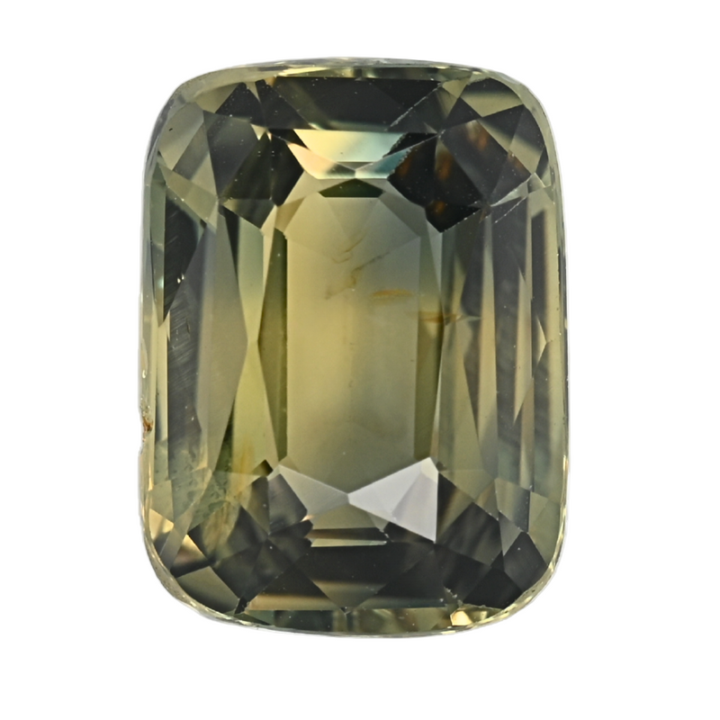 Close-up cushion-cut teal sapphire with reflective facets and rounded corners