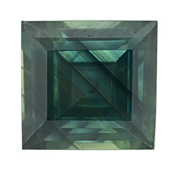 Teal rectangular sapphire gemstone with step facets, close-up