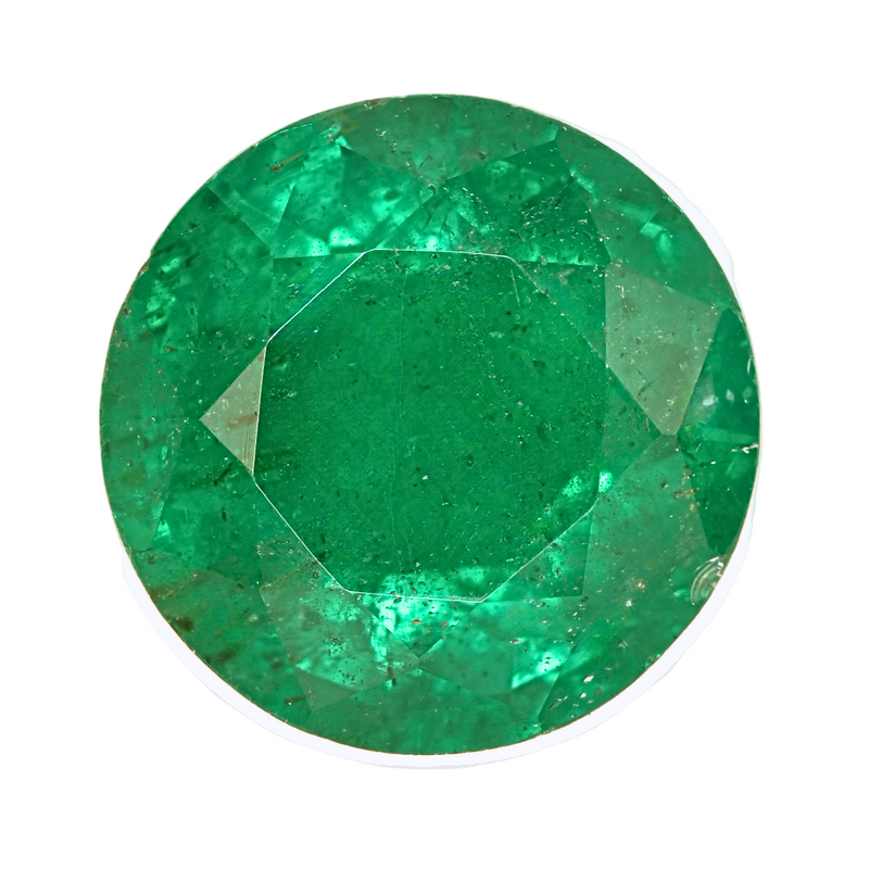 Oval green emerald gemstone close-up showing bright facets and table
