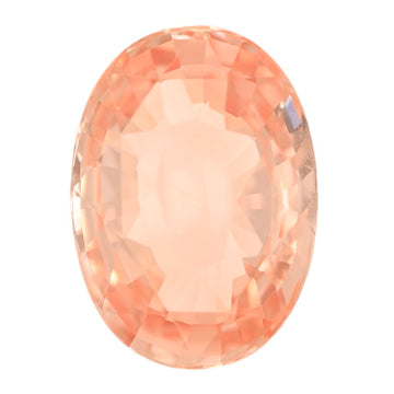 Oval padparadscha sapphire gemstone close-up with peach-orange facets