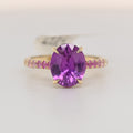 14k yellow gold sapphire ring with oval purple gemstone and jeweled band