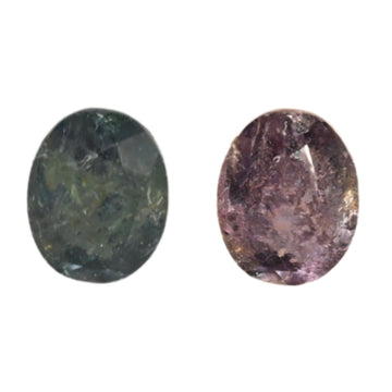 Close-up oval alexandrite gemstones: dark green and deep purple facets
