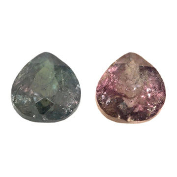 Close-up of pear-cut Alexandrite gemstones: green and pink-purple