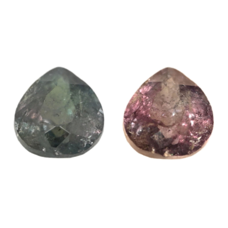 Close-up of pear-cut Alexandrite gemstones: green and pink-purple