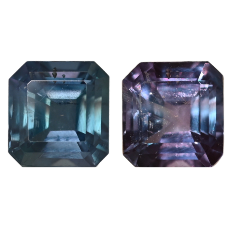 Emerald-cut alexandrite gemstones showing blue and purple tones, pair