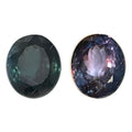 Pair of round faceted gemstones with dark green and purple tones