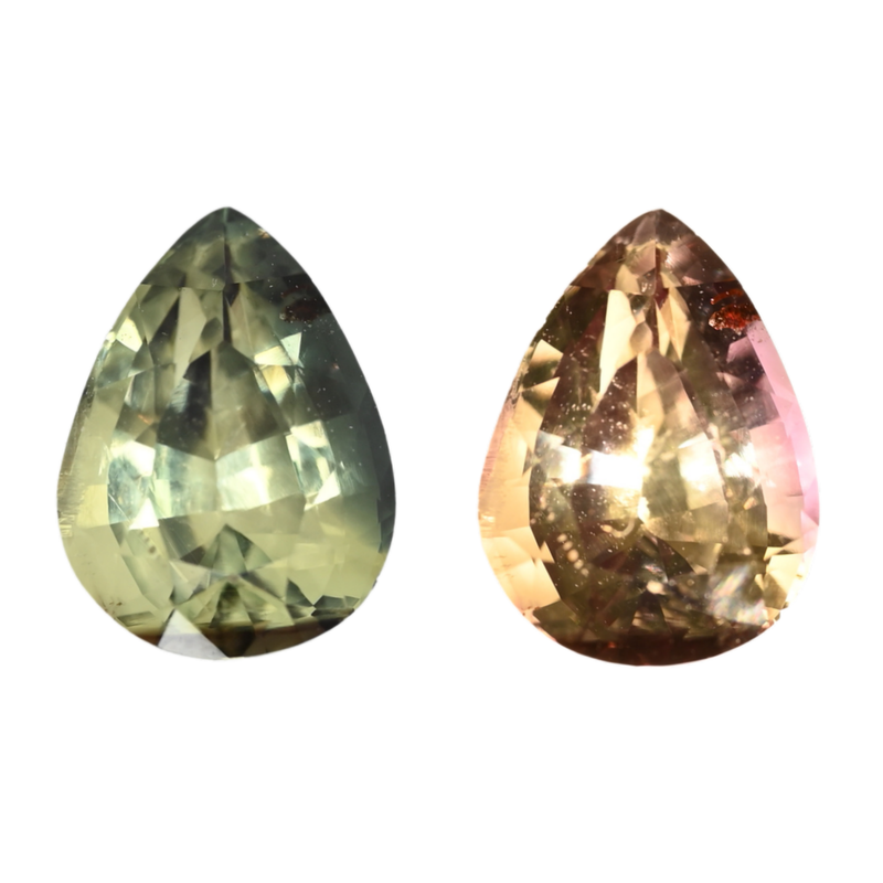 Pair of pear-cut gemstones: green and pink-violet, faceted, side view