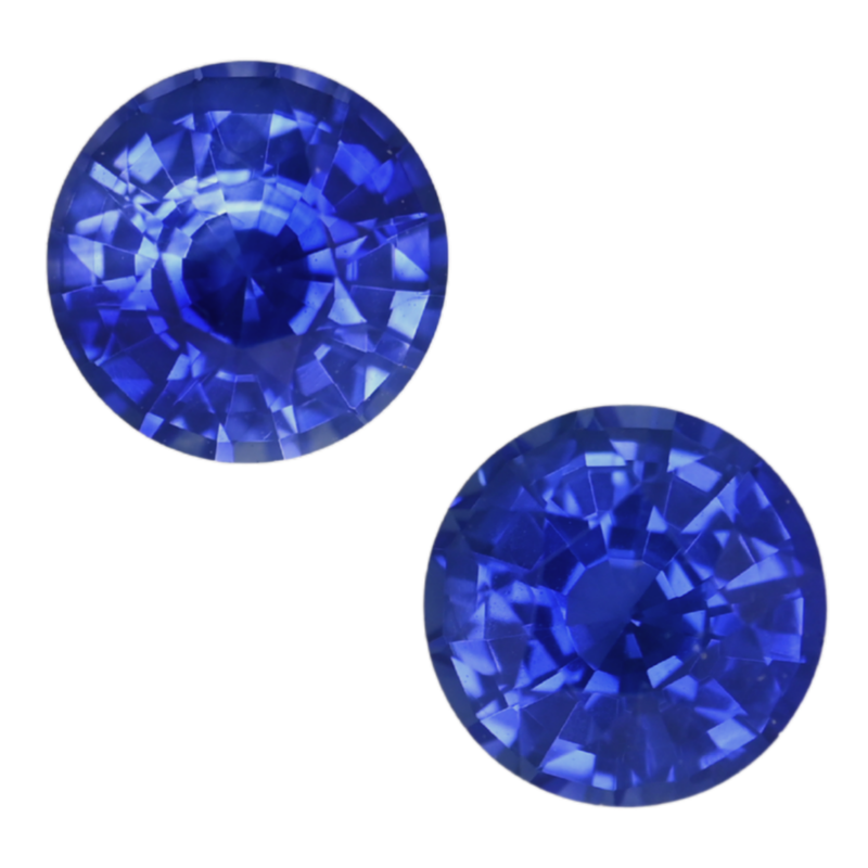 Pair of round blue sapphire gemstones, faceted