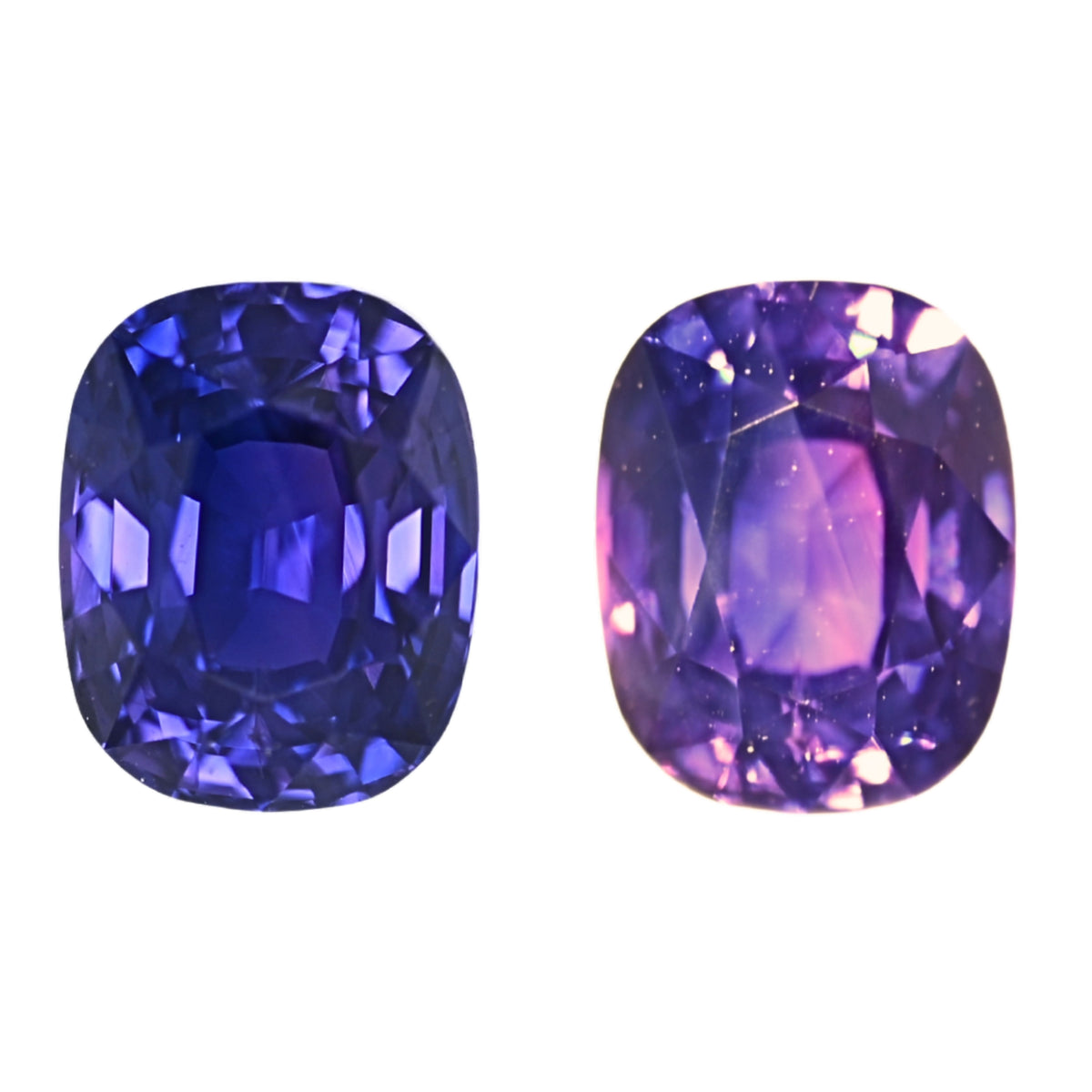 Two cushion-cut purple sapphire stones, blue-violet and purple facets