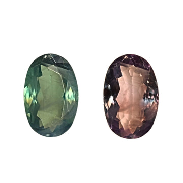Oval faceted alexandrite gemstone in green and purple tones, split view