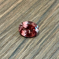 Oval faceted pink garnet gemstone