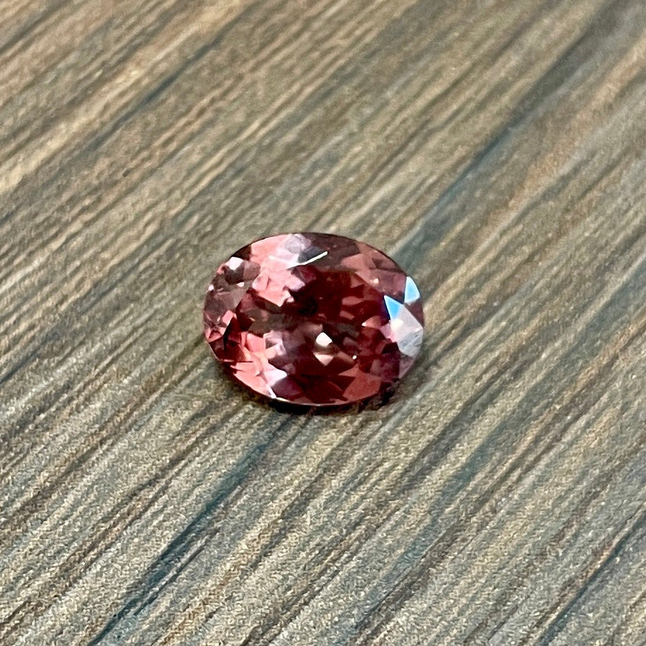 Oval faceted pink garnet gemstone