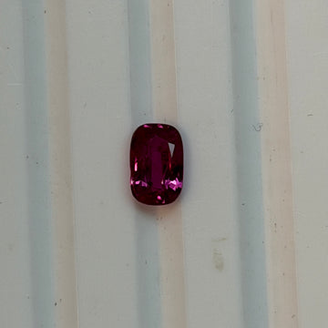 Cushion-cut ruby gemstone in deep red, natural heated, faceted cushion shape