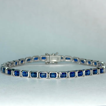 14k white gold sapphire bracelet with emerald-cut blue stones and box clasp