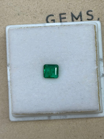 Natural emerald gemstone, rectangular step-cut in deep green