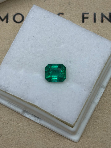 Emerald-cut natural emerald gemstone, deep green octagonal facets