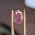 1.16ct alexandrite gemstone, oval purple stone in two-prong metal setting