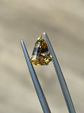1.52-carat bi-color sapphire, triangular faceted loose gemstone held in tweezers