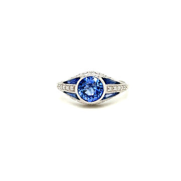 Oval blue sapphire center with diamond accents, 14k white gold ring