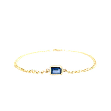 Bezel-set square blue sapphire on gold link chain bracelet