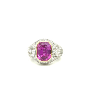 Platinum ring with pink sapphire center and diamond pavé