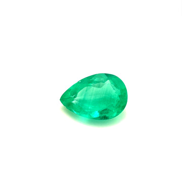 Pear-shaped emerald gemstone, faceted bright green, loose stone