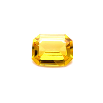 Emerald-cut yellow sapphire gemstone with faceted step-cut sparkle