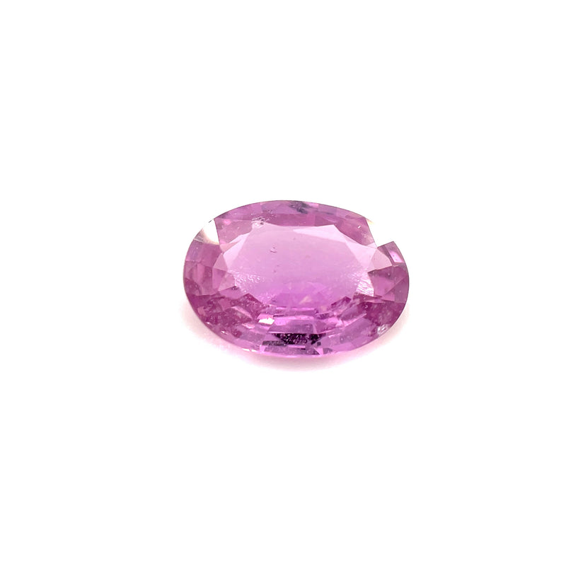 Oval faceted pink sapphire gemstone, purple-pink