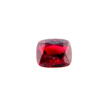 Cushion-cut ruby gemstone, deep red with polished faceted surface