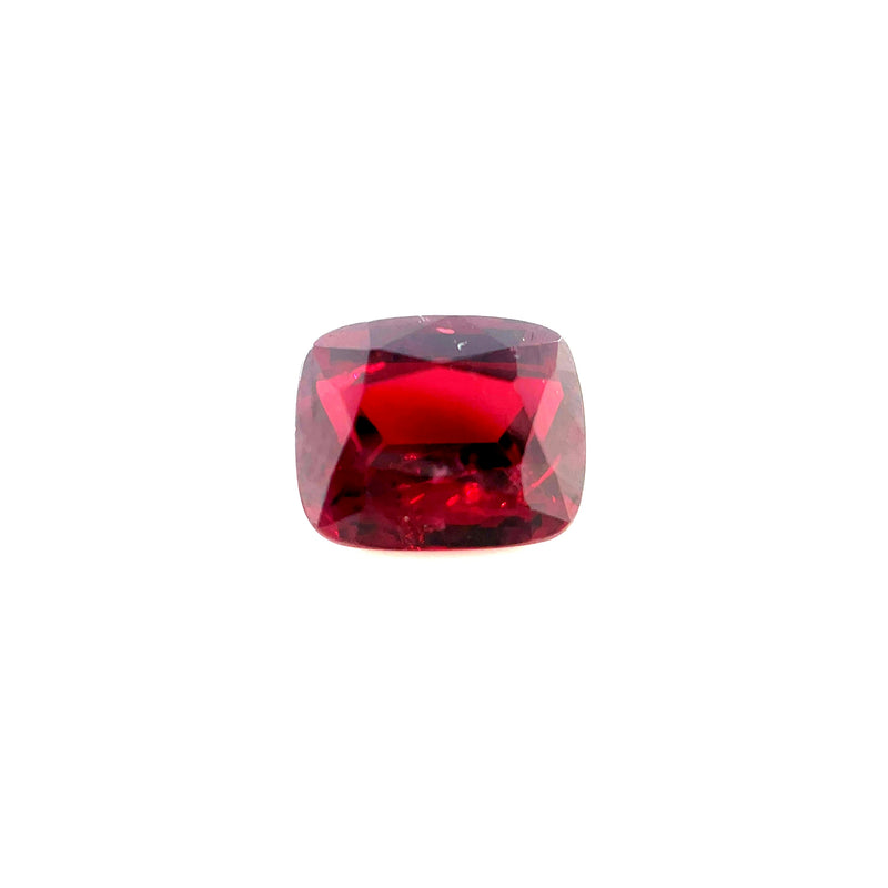 Cushion-cut ruby gemstone, deep red with polished faceted surface