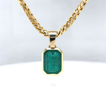 14k yellow gold emerald pendant with octagonal green gemstone on chain