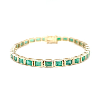 Bezel-set emerald tennis bracelet in 14k yellow gold