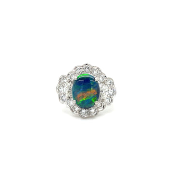 Platinum opal and diamond ring with oval dark opal center and diamond halo