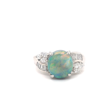 Platinum ring with oval opal cabochon and diamond side stones