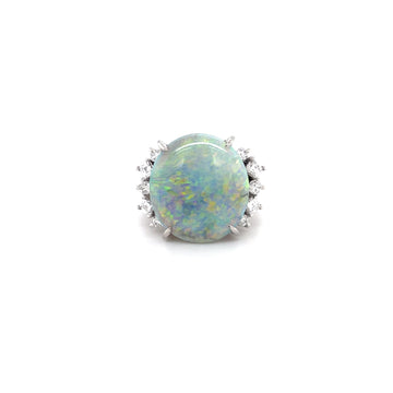 Oval opal centerpiece with diamond halo on a platinum ring