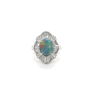 Platinum opal and diamond ring with oval opal center and scalloped diamond halo