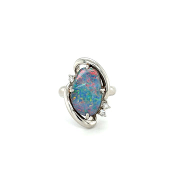 Platinum ring with oval opal center and small side diamond accents