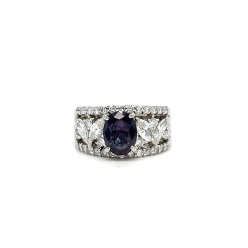 Platinum ring with purple oval center stone, diamond halo, wide band